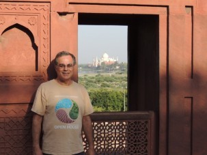 Standing next to a window in the Agra Fort with a view of the Taj Mahal farther down the Yamuna River.