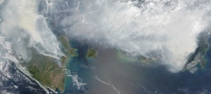 Thick smoke from El Nino-related fires shrouds the Indonesian islands of Sumatra (left) and Kalimantan (right), September 2015. (NASA)
