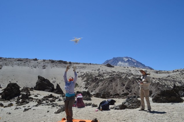 Flying the drone on the lava flows, with Descabezado Grande in the background. Photo: Kevin Krajick