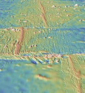Modern mapping shows a mid-ocean ridge running from the top of the image to the bottom, with two transform faults perpendicular to the ridge. Via GeoMapApp