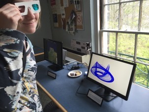 DEES graduate student Laura Haynes dons 3D goggles to view Jonny Kingslake's video &quot;The Nye Attractor&quot;