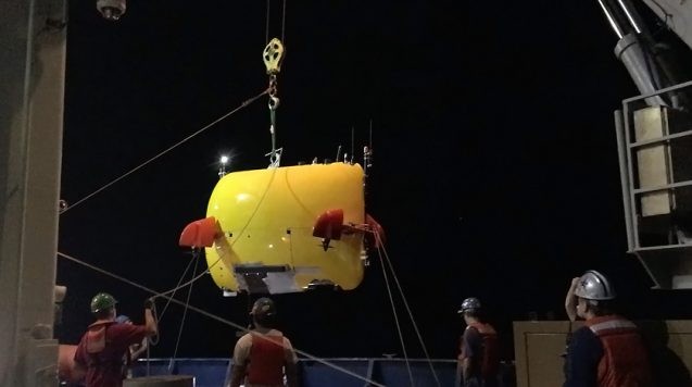 Aboard research cruises, the teams work around the clock to make use of every precious second of sea time. Bridgit Boulahanis's team launches the AUV <i>Sentry</i> in the evening and monitors its progress through the night. Photo: Bridgit Boulahanis