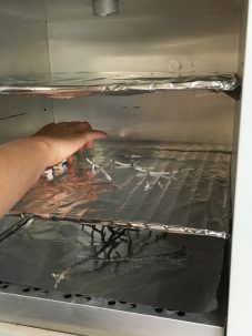 Corals collected from the seafloor go into an oven for drying. Photo: Bridgit Boulahanis