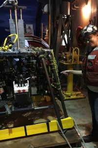 Bridgit Boulahanis with the camera platform just hoisted aboard ship. Photo courtesy of Bridgit Boulahanis