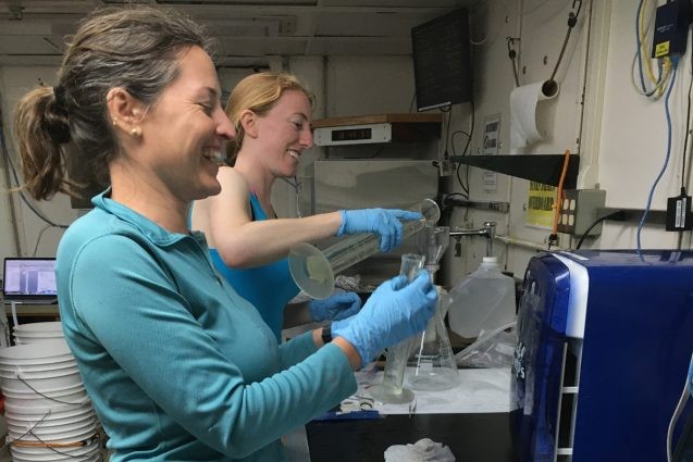 Amanda Netburn of NOAA (left) and Doreen McVeigh of North Carolina State University work in a shipboard lab. Photo: Bridgit Boulahanis