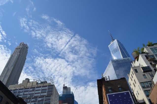 On the morning of Sept. 11, 2001, two jets streaked through the clear blue sky over lower Manhattan into the towers of the World Trade Center. This photo was taken near the site on the morning of Aug. 11, 2016. At right, the new Freedom Tower. (Kevin Krajick)