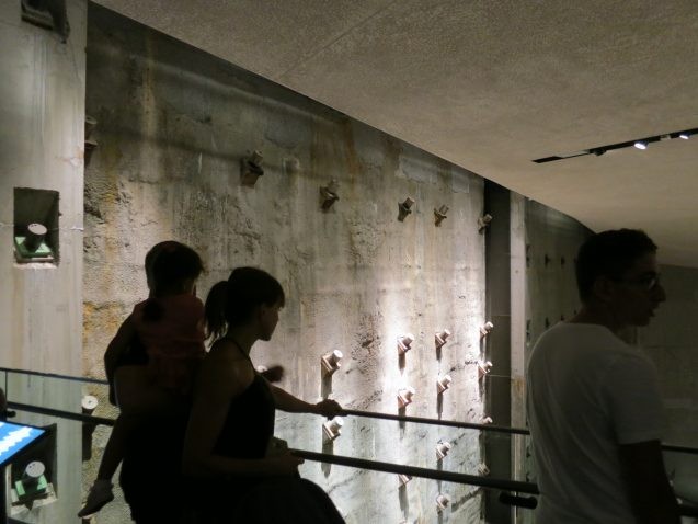 Visitors to the underground September 11 Museum view the massive retaining wall that once surrounded the towers' foundations. Seismic waves from the collapse first passing through this wall were detected more than 250 miles off. (Kevin Krajick)