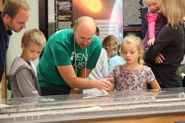The Lamont Core Lab was another favorite, with visitors lined up out the door. Billy D'Andrea shows young guests how scientists use deep-sea sediment cores to learn about climates in the past.