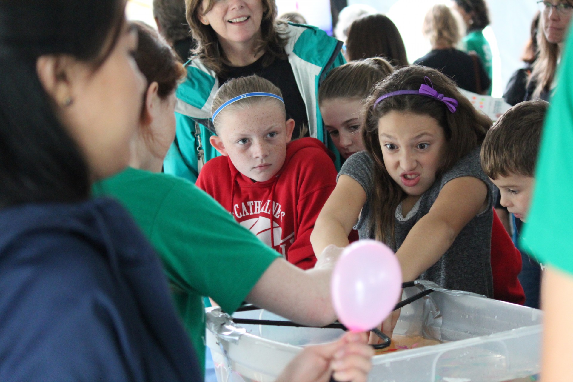 By dunking balloons and releasing the air, Lamont Open House visitors saw how scientists can use air bursts underwater to image structures beneath the seafloor. Open House 2016