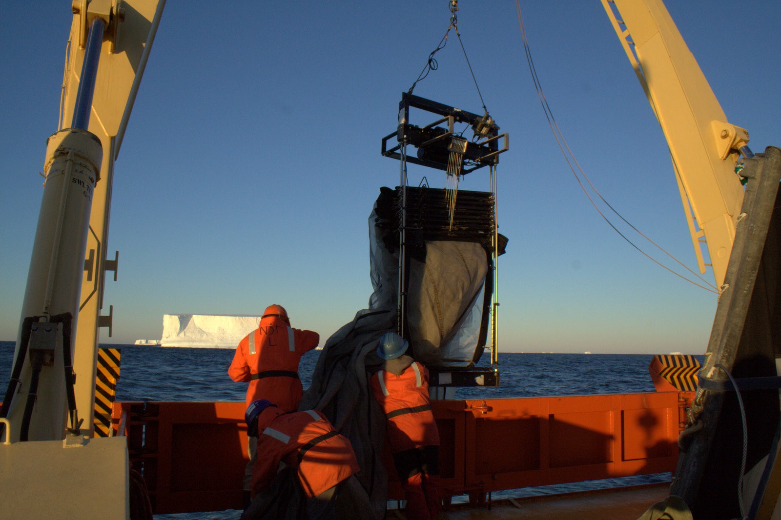Scientists launch a Multiple Opening/Closing Net and Environmental Sensing System (MOCNESS) from the R/V Gould off the West Antarctic Peninsula. When towed behind a research vessel, the system’s nets collect plankton while sensors provide real-time information about the physical properties of the seawater. Photo: Naomi Shelton/LDEO