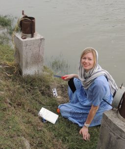 Liz measures and describing the sediments that have accumulated over the base of the wells since they were installed in 2011.