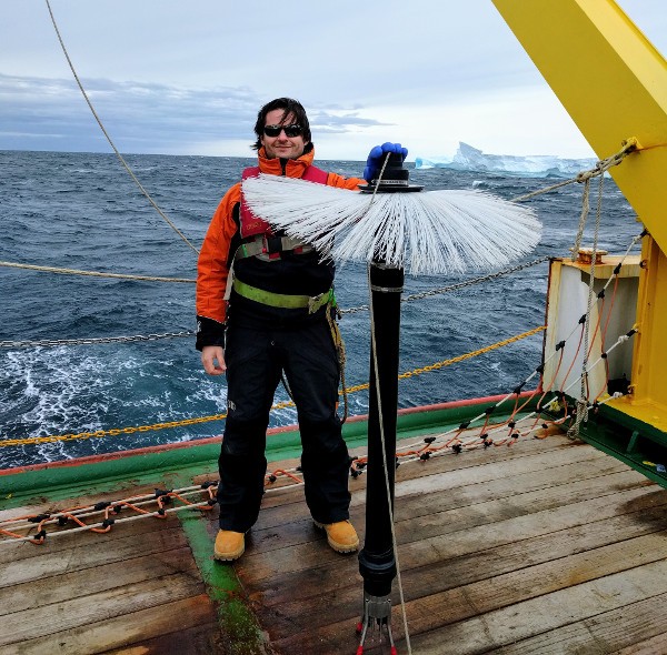 Coauthor Pierre Dutrieux with an instrument that detects fluctuations in ocean water, Terra Nova Bay, Antarctica, Jan. 31, 2017. A similar instrument was used to show why fresh water from melting ice shelves settles far below the surface instead of rising. (Courtesy Pierre Dutrieux/Lamont-Doherty Earth Observatory