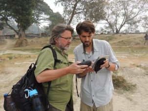 Chris and Dan discussing notes on locations to visit based on recent satellite images and entering them into the GPS.