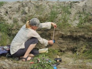 Liz measures the position of the hammered in sampling tube before we dig out and collect our last sample, a silt from the Jamuna (Brahmaputra) River.