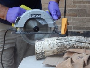 Wasser cuts samples from a carved tusk.