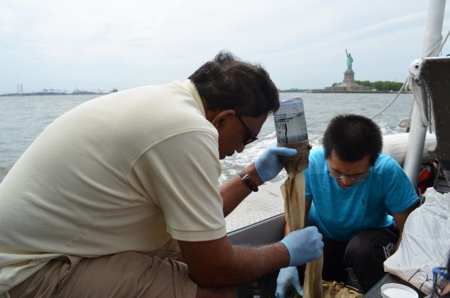 Aboard a vessel run by the environmental group Riverkeeper, oceanographer Joaquim Goes of Lamont-Doherty Earth Observatory (left) and PhD. student Ye Li filter water from New York harbor. They were on a mission to study the prevalence of plastic microbeads. (Photos: Kevin Krajick, unless otherwise credited.)