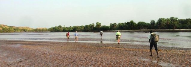 Research team crossing the Turkwel River