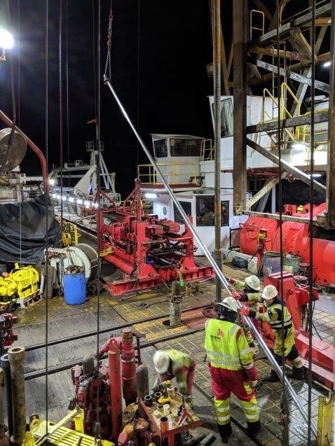 floormen and drillers work on ship
