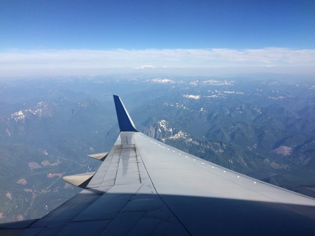 airplane wing and rocky mountains