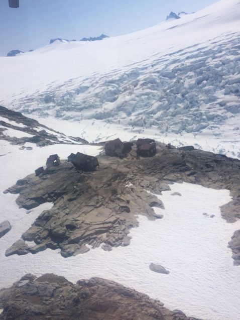 huts surrounded by rock and ice