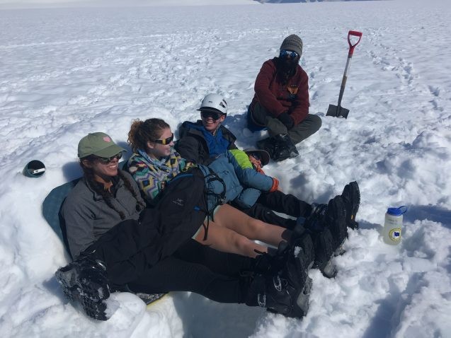 team resting in the snow