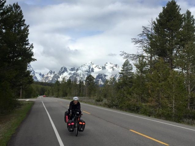 cyclist with mountains in background