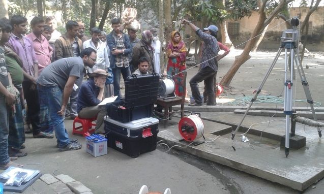 Britt Huhmann from MIT and Mahfuz Khan from the University of Delaware deploy a camera down a well to verify its depth