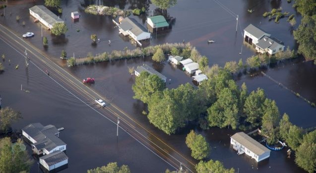 Buildings surrounded by water flowing out of North Carolina's Cape Fear River in the aftermath of Hurricane Florence. (Photo: Staff Sgt. Mary Junell/U.S. Army)