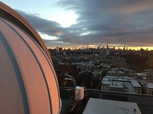 dome and city skyline at sunset