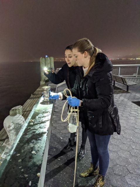 students with jars of water