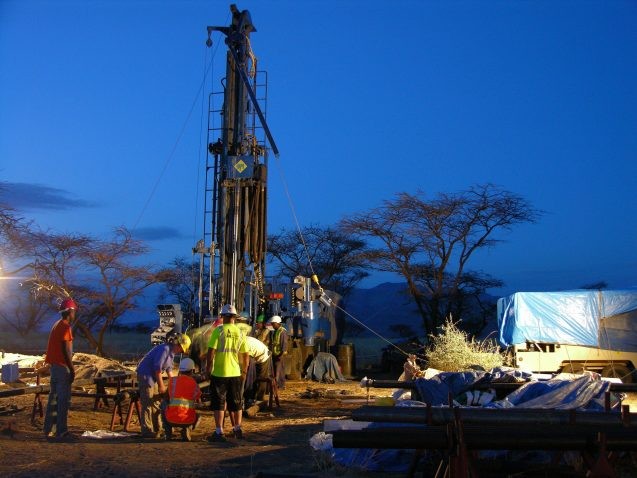 workers and drilling rig