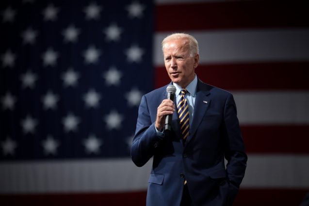 joe biden in front of american flag