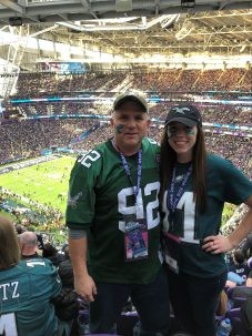 reed and daughter with stadium behind them