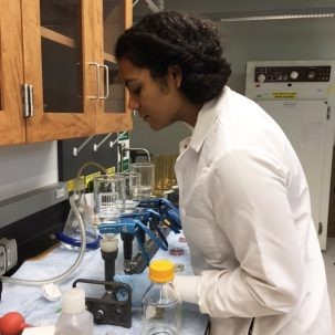 elise myers filters water in a lab