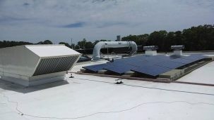 white rooftop with solar panels