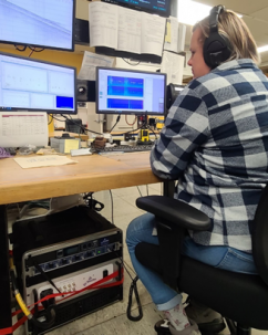 person at desk listening for vocalizations