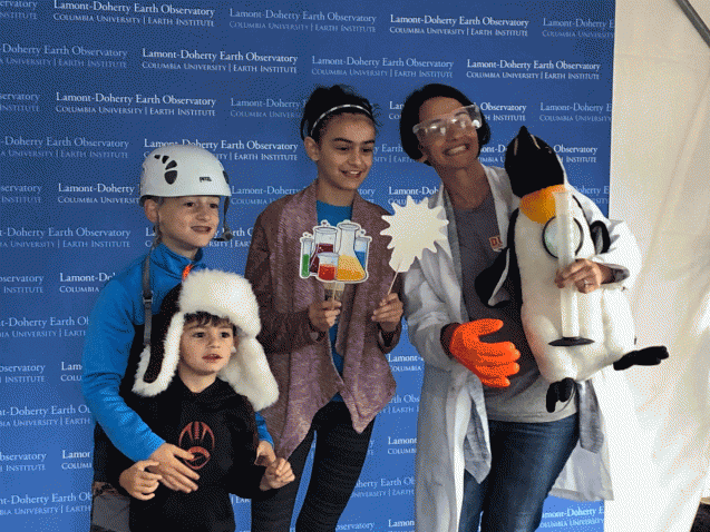 kids in photo booth with props
