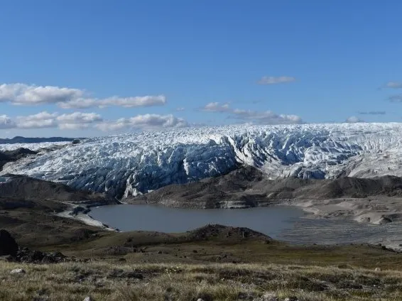 A newly forming lake at the edge of the Greenland ice sheet, exposing sediments released by the ice. Such lake beds are becoming common as the ice recedes. Credit: Kevin Krajick/Earth Institute