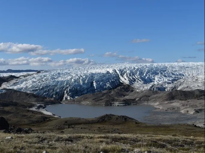 A newly forming lake at the edge of the Greenland ice sheet, exposing sediments released by the ice. Such lake beds are becoming common as the ice recedes. Credit: Kevin Krajick/Earth Institute