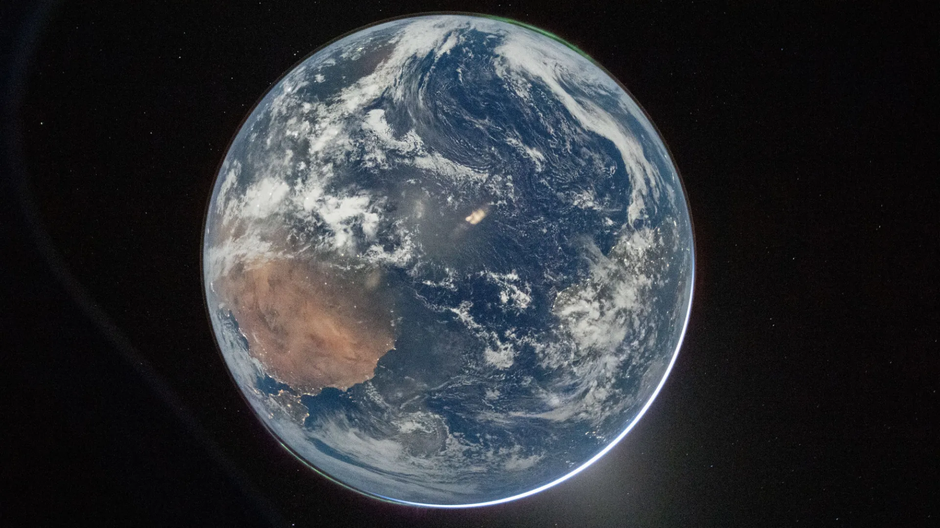 Hello, World! This nighttime picture of Earth was taken on April 2, 2026, by an Artemis II crew member aiming a camera through a window of the Orion spacecraft. Credit: NASA