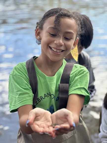 Young girl with fish in her hand