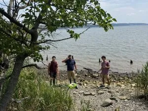 Next Gen interns collecting marine debris along the shore of Piermont Pier