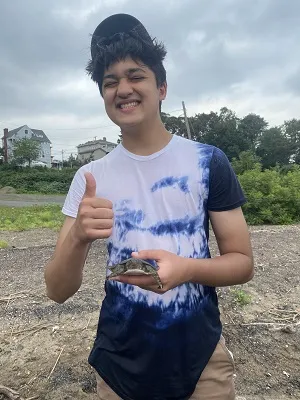 Talha Uddin is exploring environmental science on the banks of the Hudson River.
