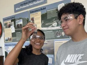 Next Gen Interns look at an alkalinity test sample