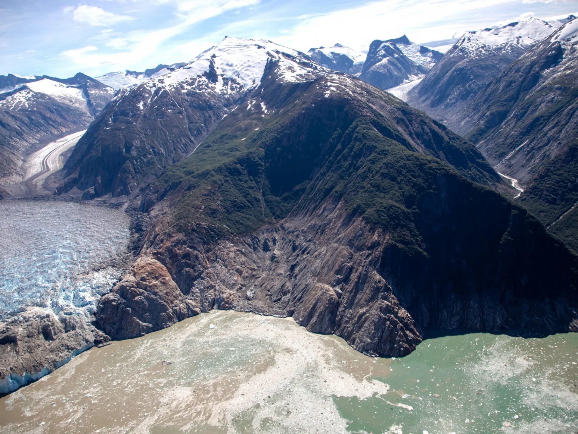 Aerial photo of the highest runup resulting from the August 10, 2025 landslide-triggered tsunami in Tracy Arm, taken during a U.S. Geological Survey field reconnaissance flight on August 13, 2025. View direction is approximately south. Credit: John Lyons/U.S. Geological Survey.