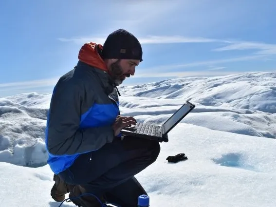 Marco Tedesco on the Russell Glacier, southwest Greenland, summer 2018. Credit: Kevin Krajick