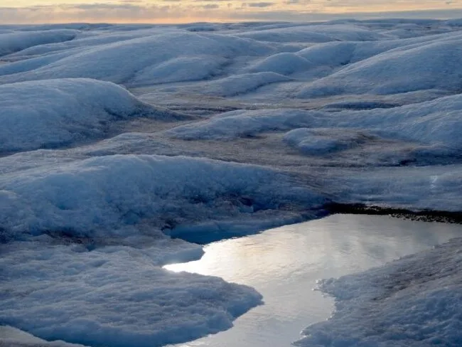 A melting pond atop Greenland’s ice sheet. Credit: Marco Tedesco