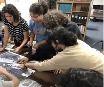 Students working on a puzzle.