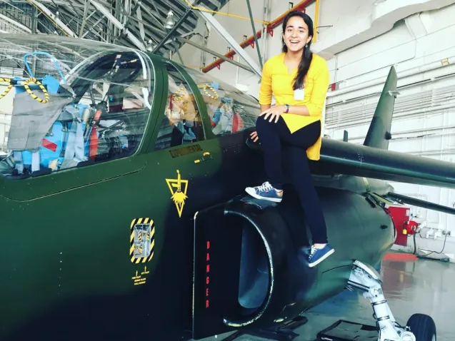 Garima Raheja with the NASA Alpha Jet, which is equipped with instruments to measure air quality and greenhouse gases, during her summer internship at NASA Ames Research Center.