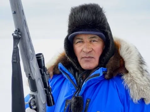 Roswell Schaeffer Sr., an Iñupiaq elder and hunter from Kotzebue and coauthor of a recent study of ice-season changes, hunts for bearded seals, May 2019. Credit: Sarah Betcher, Farthest North Films